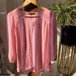 AND pink blouse